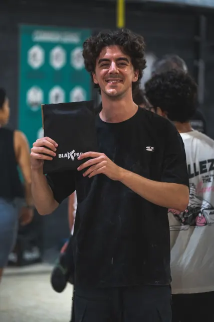 A winner holding up his Black Pad prize.